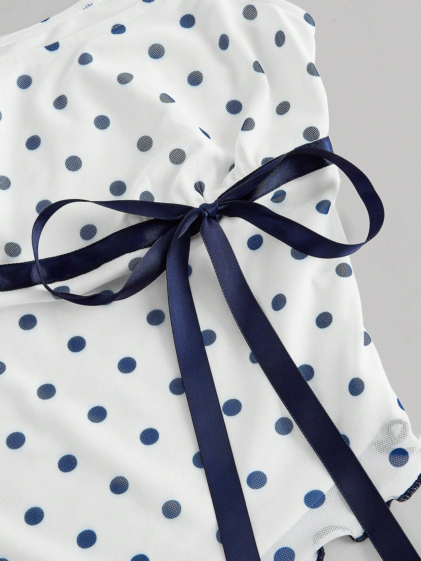 MOD Asymmetric Bow Ruched Mesh Polka Dot Top